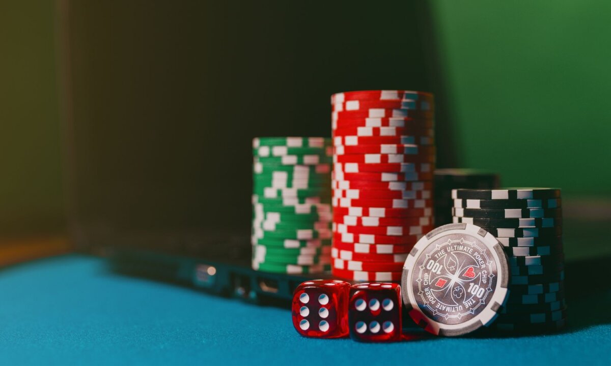 Casino chips dice and playing cards for the NZ$20 balance route